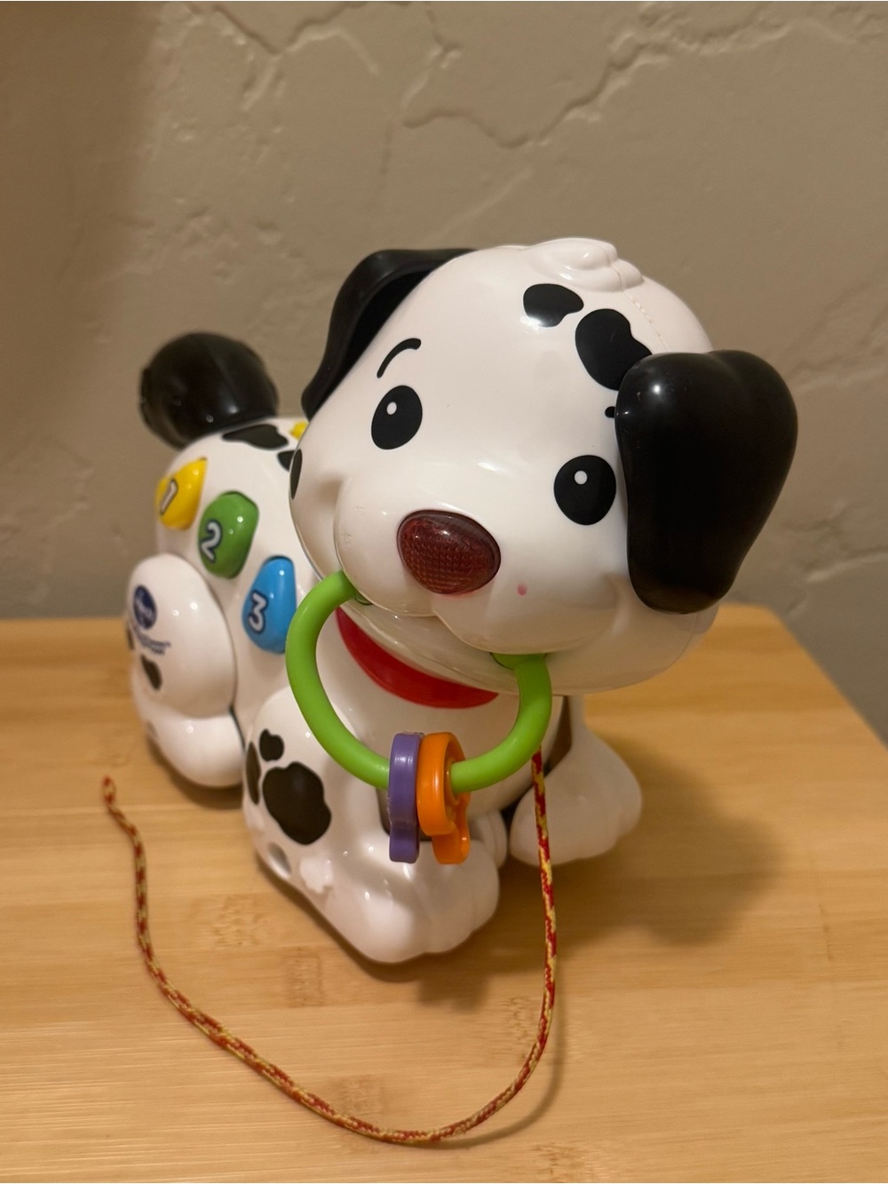 Interactive White and Black Dalmatian Pull-Along Toy Dog with Colorful Rings